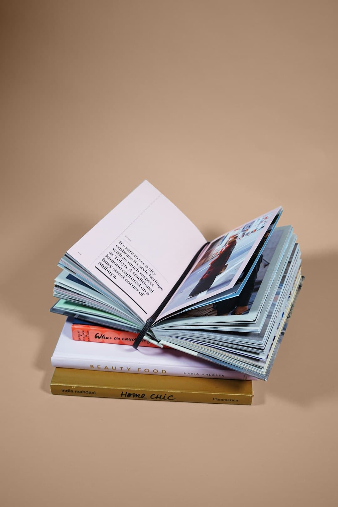 open book on top of several stacked books